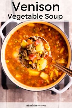 a spoon full of vegetable soup on top of a wooden table with text overlay