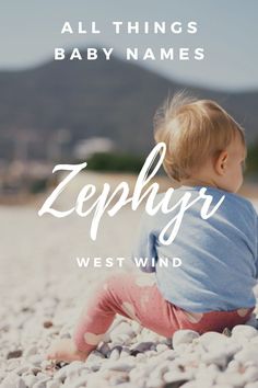 a baby sitting on rocks with the words zephyr west wind in front of it