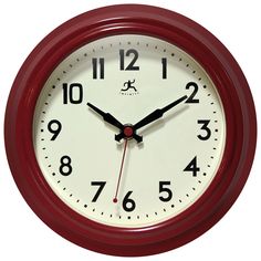 a red clock with black numbers on the face