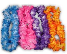 five different colors of feather leis laid out on the ground next to each other