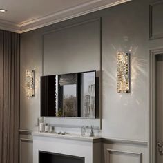 a bathroom with a fireplace, mirror and lights on the wall next to each other