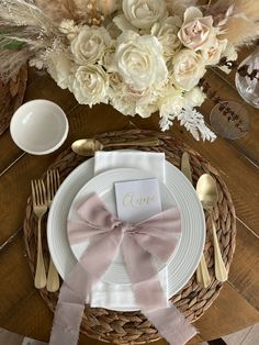 a place setting with flowers and silverware