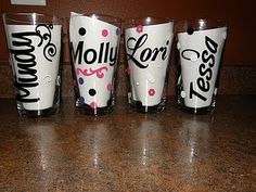 four shot glasses sitting on top of a counter next to each other with the word moly ford printed on them