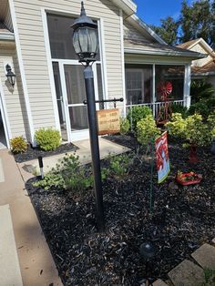 a lamp post in front of a house