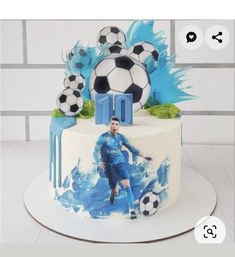 a soccer themed birthday cake with the number 10 on it and a photo of a man kicking a soccer ball