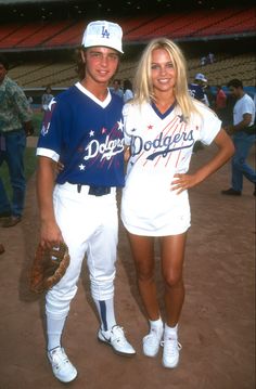 two baseball players standing next to each other in the dirt at a game - stock image