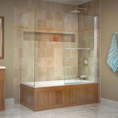 a bath room with a sink and a bath tub next to a towel hanging on the wall