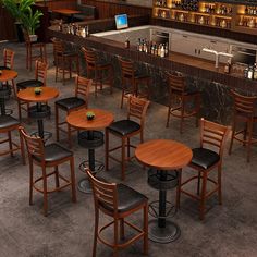 an empty bar with wooden tables and chairs