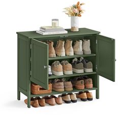 a green cabinet with many pairs of shoes on it and a vase filled with flowers