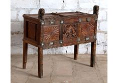 an old wooden table with two drawers on one side and metal handles on the other