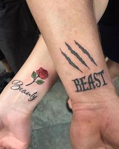 two people with matching tattoos on their arms that say beauty and beast next to each other