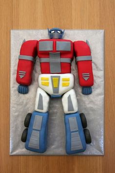 a birthday cake made to look like a robot from the movie opttropict