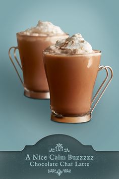 two cups filled with hot chocolate and whipped cream