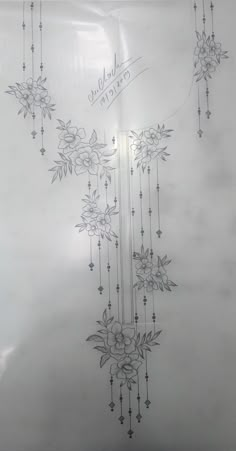 a drawing of flowers on a sheet of paper with writing in the middle and bottom