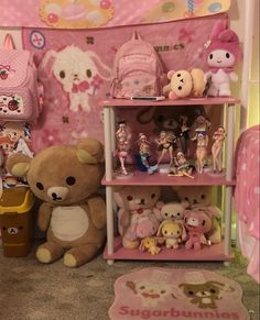 there are many stuffed animals and toys on the shelves in this toy room, including a teddy bear