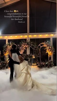 a bride and groom are standing in the clouds at their wedding reception with an inspirational quote above them