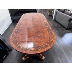 a wooden table sitting on top of a hard wood floor