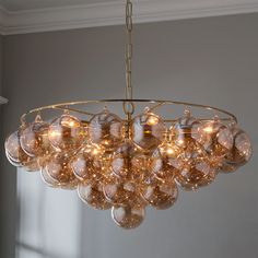 a chandelier hanging from a ceiling in a room