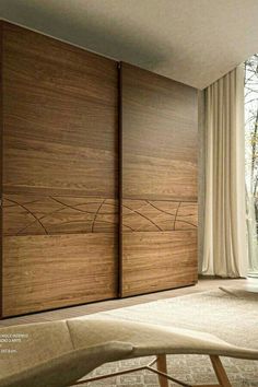 the sliding doors are made from wood and have been designed to look like an abstract piece of art