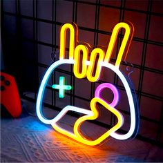 a neon sign that says boo and is lit up