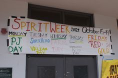 a sign on the side of a building that says spirit week and other words written in different languages