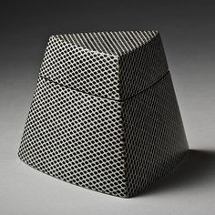 a black and white box sitting on top of a table