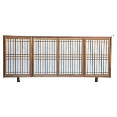 a wooden screen with three panels on each side