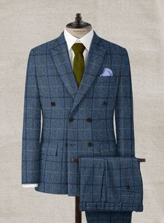 Channel boss vibes everyday with this refined Harris Tweed Gordon Blue Double Breasted Suit to look great in this new season. Crafted from wool, the suit is a stylish piece for your next elegant affair with a shade of blue that will help you charm your way through tedious tasks and an impeccable checks design that carries a timeless appeal. The suit will seamlessly blend together with your favorite shirt to create an eye catching ensemble. 
 
 Look Includes  Harris Tweed Gordon Blue Fabric  Doub Timeless Tweed Suit With Welt Pockets, Tweed Notch Lapel Suit For Business Casual, Tailored Double Breasted Wool Suit, Tweed Three-piece Suit With Notch Lapel For Work, Business Casual Tweed Suits With Notch Lapel, Tweed Three-piece Suit With Notch Lapel For Business, Formal Tweed Suit With Suit Collar, Winter Office Tweed Suit, Winter Blue Tailored Double Breasted Suit