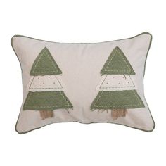 a white pillow with green trees on it