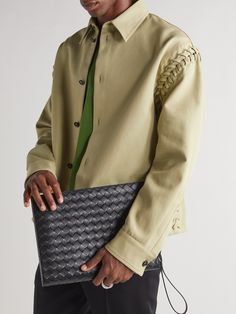 Bottega Veneta's 'Avenue B.' pouch is sized for a tablet, making it ideal for everything from boardrooms to travelling. It's made from black leather that's woven using the label's signature intrecciato technique and finished with a zipped pocket at the back. Designer Clutch Pouch, Designer Travel Clutch, Modern Laptop Sleeve Clutch Pouch, Modern Business Pouch With Dust Bag Included, Designer Pouch Bags For Work, Designer Pouch Bag For Workwear, Designer Leather Clutch For Business, Designer Work Pouch Bag, Designer Workwear Pouch Bag