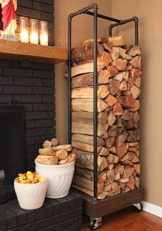 a fire place with logs stacked on top of it