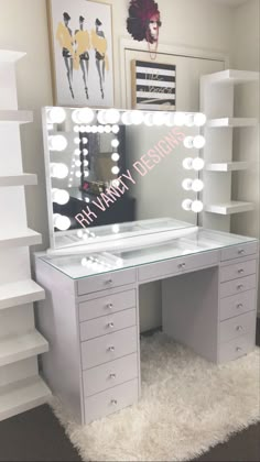 a vanity with lighted mirror and drawers in a room that has carpet on the floor