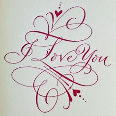 the word i love you written in red ink