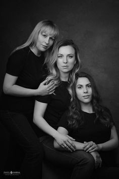 three women are posing for a black and white photo with their arms around each other