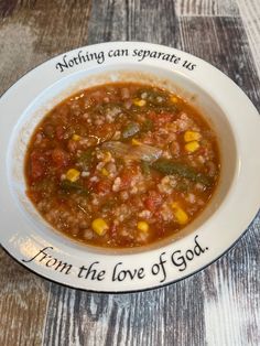 a white bowl filled with soup on top of a wooden table