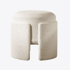 a white stool with two legs on it