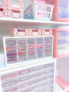 the shelves are filled with plastic drawers and bins