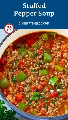 a bowl of stuffed pepper soup with green peppers and red bell peppers in it, next to parsley on the side