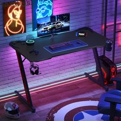 a gaming desk with two monitors on it in front of a brick wall and neon lights