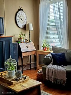 a living room filled with furniture and a clock on the wall