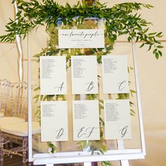 the seating cards were placed on top of each other for an elegant touch to the ceremony