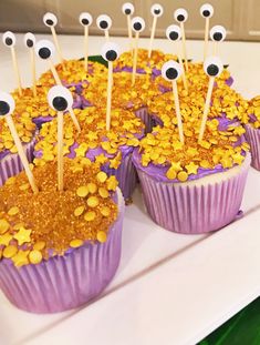 cupcakes decorated with googly eyes and gold sprinkles