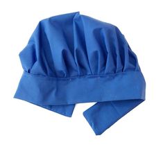 a blue hat is laying on top of a white surface with one side rolled up