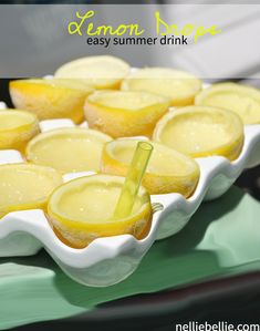 lemon slices are sitting in a bowl on a green tray with the words lemon tree easy summer drink