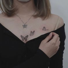 a woman with two butterflies on her chest