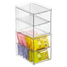 three tiered plastic storage bins with tissue and toothpaste in each compartment