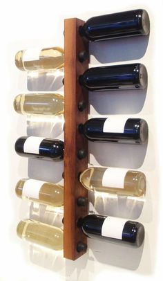 a wine rack with several bottles on it