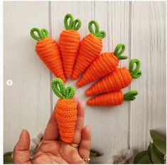 there are four carrots that have been made out of yarn