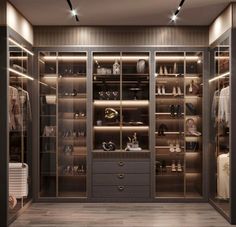 a walk - in closet with glass doors and lots of shoes on the shelves next to it