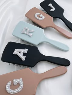 four different styles of hair combs with diamond bling on the top and bottom